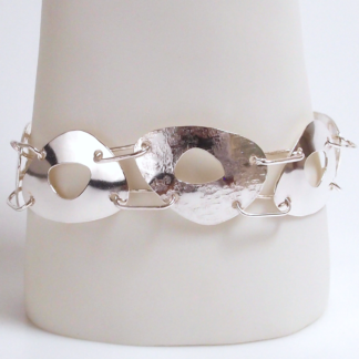 Handmade one-of-a-kind egg-shaped textured multi-link sterling silver bracelet by MetalSmitten.com