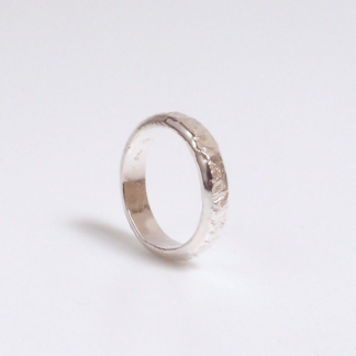 Handmade textured sterling silver ring by MetalSmitten.com